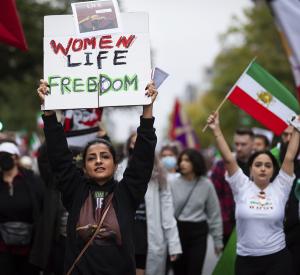 Washington, DC, Sept. 30, 2022—A protester carries a sign at a protest for Mahsa Amini, freedom in Iran, and solidarity with Iranian protesters.