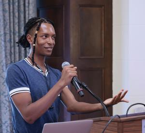 Bryant Taylor invites attendees to play a Bingo icebreaker at the 2023 New Faculty Welcome Reception / photo by Jack Liu