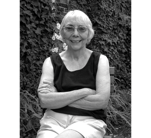 A black and white image of Joan Acker