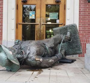In June, protesters tore down the Pioneer statue and used it to block the entrance to Johnson Hall / photo by Carrington Powell, Daily Emerald.
