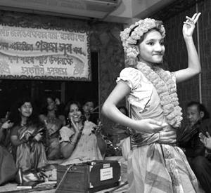 A teenager dances at the acid survivors healing group in Bangladesh.