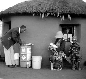 : Ntate Kholumo, member of the ’Muela research team, interviews a family affected by the Lesotho Highlands Water Project.