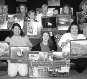 Shannon Bell, front center, with the Harts Photovoice Group at their exhibit in West Virginia, April 2009.