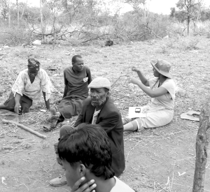 Easther Chigumira, far right, conducts a household interview. The author notes that the presence of males at most interviews is indicative of the male/female dynamics in her study area. She found it difficult to interview women alone, but when she was able to do so, they spoke freely. With men or boys present, women tended to defer questions to the male. 