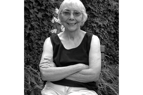 A black and white image of Joan Acker