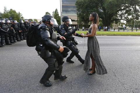Activist Leshia Evans stands her ground while offering her hands for arrest as she is charged by riot police during a protest against police brutality outside the Baton Rouge Police Department in Louisiana, USA, 9 July 2016. Evans, a 28-yearold Pennsylvania nurse and mother of one, traveled to Baton Rouge to protest the shooting of Alton Sterling. Sterling was a 37-year-old black man and father of five, who was shot at close range by two white police officers. REUTERS/Jonathan Bachman TPX IMAGES OF THE DAY