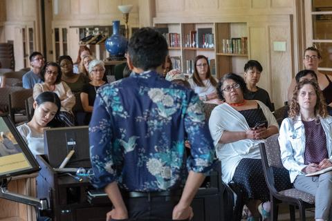 Chandan Reddy deliverered the Queer Studies Lecture at the Knight Library Browsing Room to a mixed audience of faculty, staff,  and students.  Right: Chandan Reddy listens to a question from the audience / photos by Amiran White.