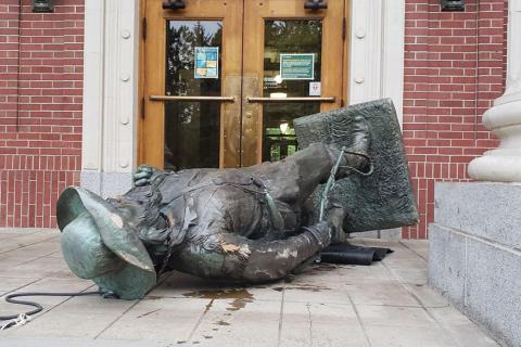 In June, protesters tore down the Pioneer statue and used it to block the entrance to Johnson Hall / photo by Carrington Powell, Daily Emerald.