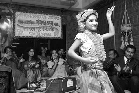A teenager dances at the acid survivors healing group in Bangladesh.