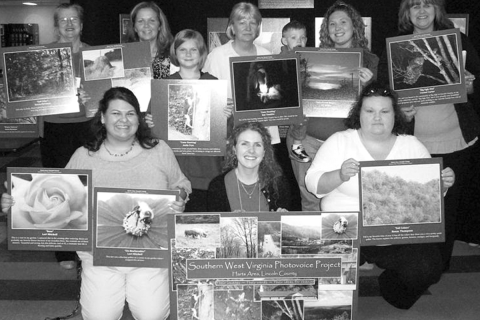 Shannon Bell, front center, with the Harts Photovoice Group at their exhibit in West Virginia, April 2009.