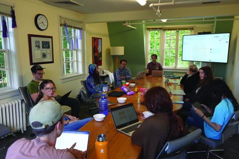 Sitting around the CSWS Jane Grant Room conference table, students offer both generative and critical feedback on their op-ed assignment drafts in the HIST 416 Calderwood Seminar last spring / photo by Owen Garvey.
