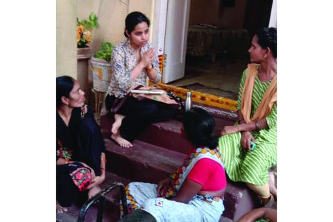 Malvya Chintakindi (center) interviews three of her participants on a recent trip to Hyderabad, India / photo provided by Chintakindi.
