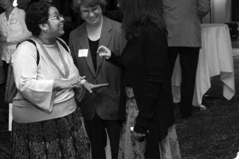 At a 2010 CSWS reception, Sangita Gopal (left) talks to colleagues Gabriela Martínez and Cecelia Enjuto Rangel while her daughter, Mohini, looks on (photo by Jack Liu).