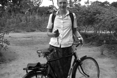 With GPS unit in hand, Ingrid L. Nelson sets out on her bicycle to survey farmer’s fields for the day. 