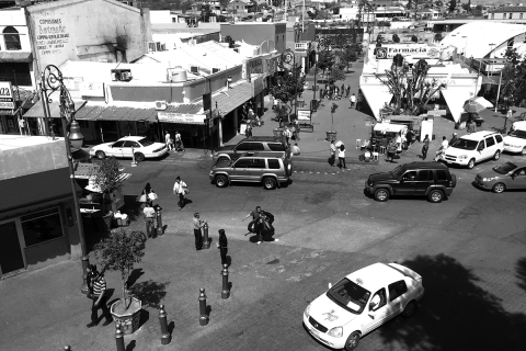 Nogales tourist area within one block of the U.S.–Mexico international boundary. The heart of “hustle” space, where deported men deploy English language skills to provide informal guide services; sell snacks, drugs, and kitschy Mexican crafts; or ask passersby for “a little help” / photos by Tobin Hansen.