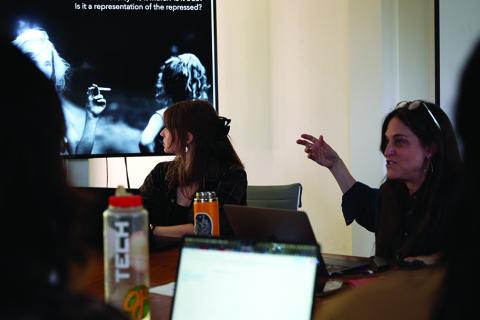Dawn Marlan, right, discusses a photograph from Sally Man’s Family Portraits with her Calderwood Seminar students / photo by Agnese Cebere.