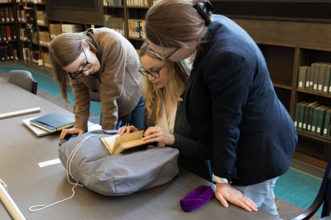 Picgtured from left: Data management librarian Erin Winter, research assistant Michele Pflug, and principal investigator Mattie Burkert. Photo by Nate Kersey.