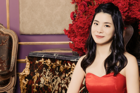 Joyce Chen pictured in a read dress.