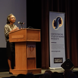 Anita Hill lectures at podium.