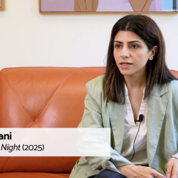 Sobhani gives an interview sitting on a couch.