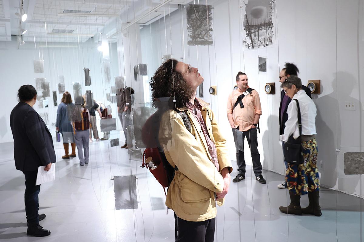 Opening reception for the Ghost Forest photography exhibit, which included Bellona's sound installation Wildfire—a 48-foot-long speaker array that plays back a wave of fire sounds at speeds of actual wildfires / photo by Jack Liu.
