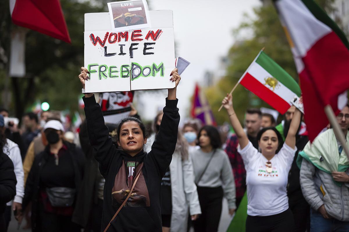 Washington, DC, Sept. 30, 2022—A protester carries a sign at a protest for Mahsa Amini, freedom in Iran, and solidarity with Iranian protesters.