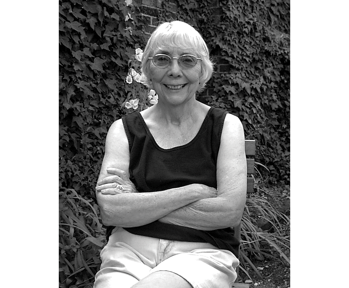 A black and white image of Joan Acker
