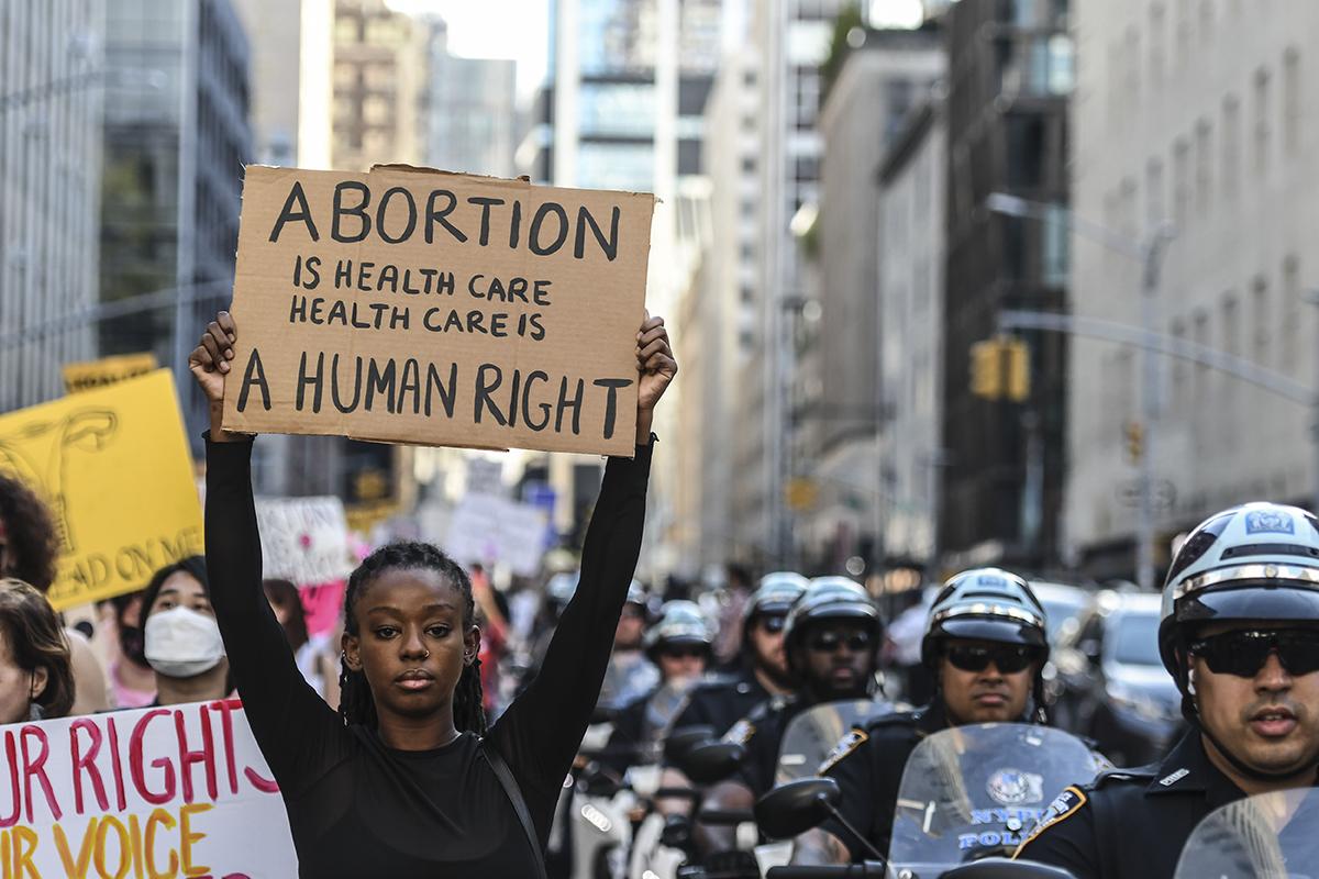 Demonstrators Attend Women's March to Defend Reproductive Rights A demonstrator holds a pro-choice sign during a Women's March in New York on Saturday, Oct. 2, 2021. Women's March and more than 90 other groups organized a national rally to protect women's reproductive rights ahead of the Supreme Court reconvening on October 4 / photo by Stephanie Keith, Bloomberg via Getty Images.