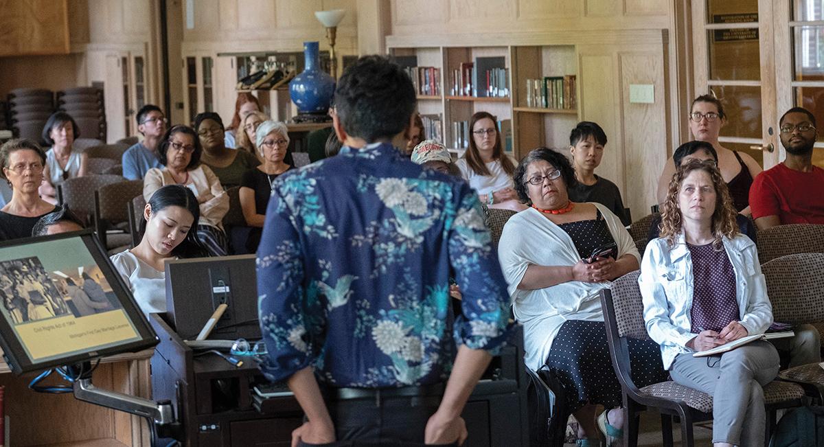Chandan Reddy deliverered the Queer Studies Lecture at the Knight Library Browsing Room to a mixed audience of faculty, staff, and students. Right: Chandan Reddy listens to a question from the audience / photos by Amiran White.
