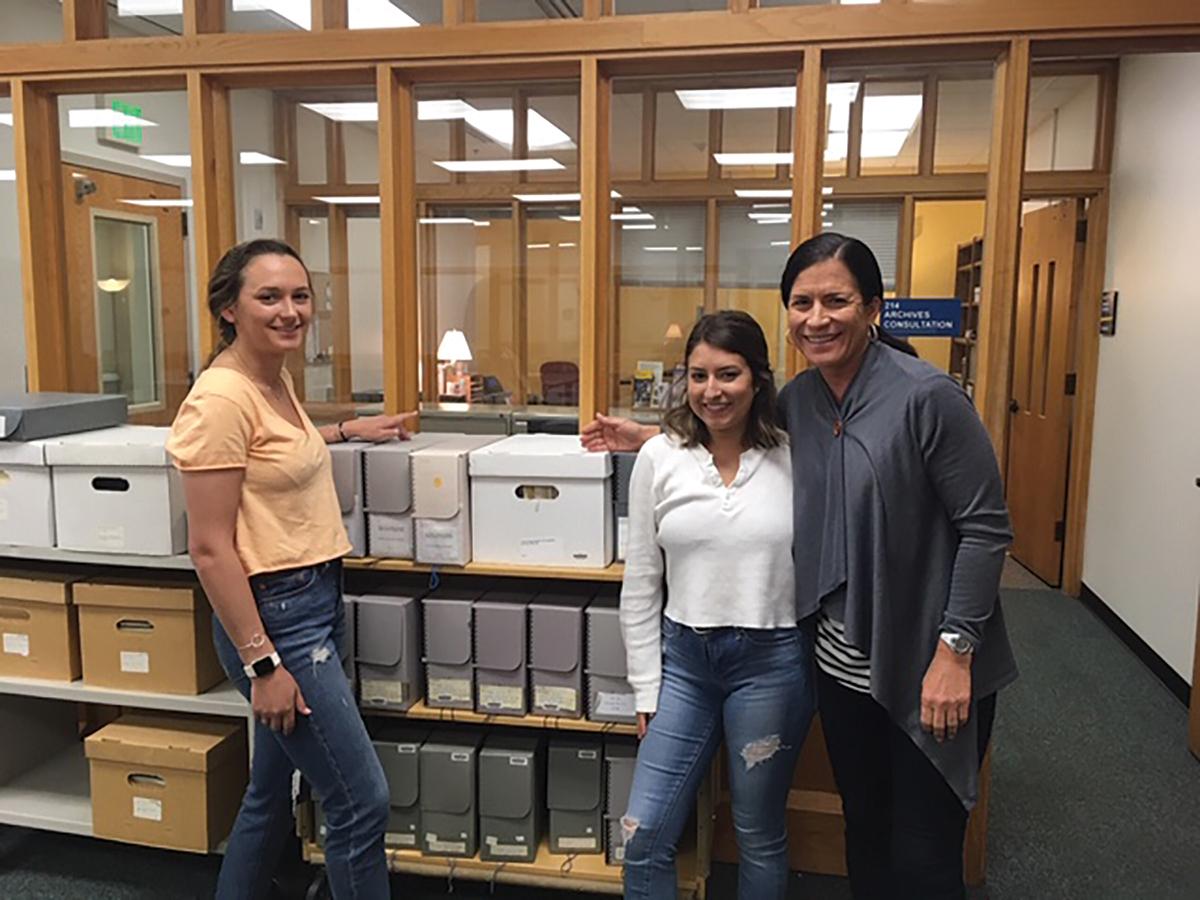 From left, Rachel McGill, Gabby Farland, and Dr. Yarris inside the University of Alaska archives at UAF-Fairbanks campus during their June, 2019 trip / photo provided by Kristin Yarris.