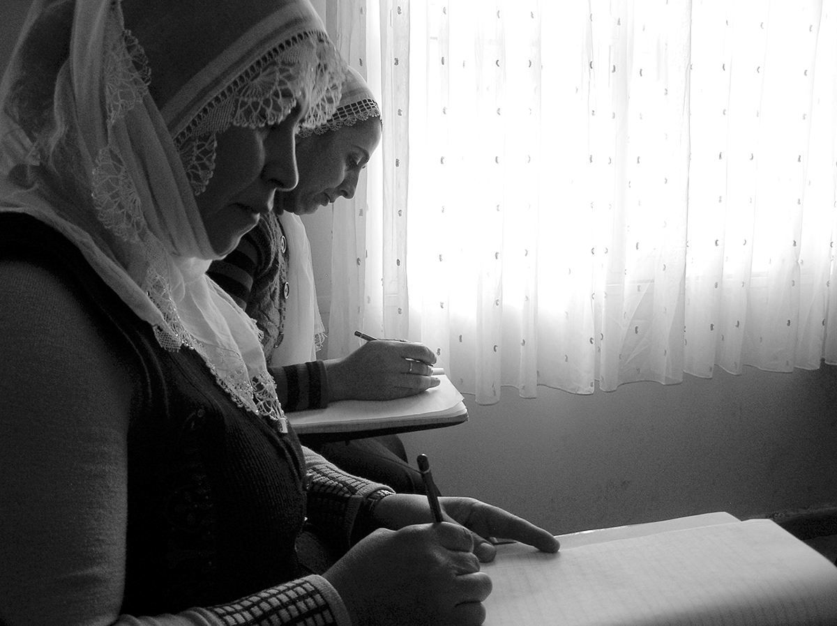 Two women in a literacy class.
