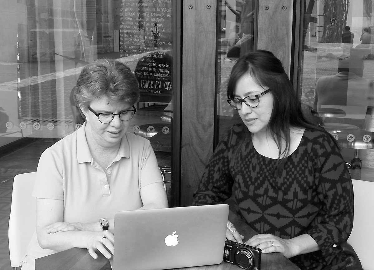 On location for a new documentary project in Oaxaca, Mexico, Sonia De La Cruz (right) looks over notes with collaborator Gabriela Martínez (summer 2014)