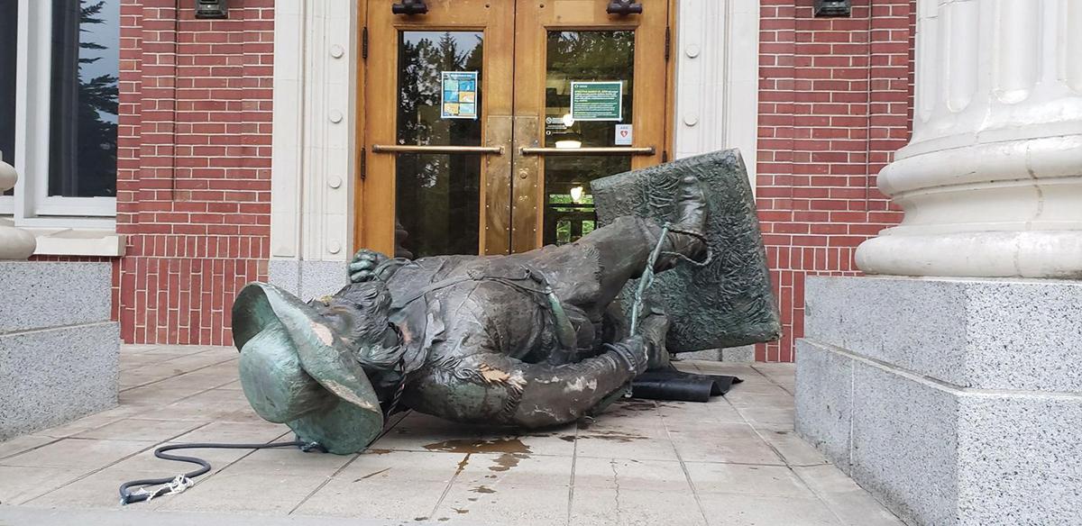 In June, protesters tore down the Pioneer statue and used it to block the entrance to Johnson Hall / photo by Carrington Powell, Daily Emerald.