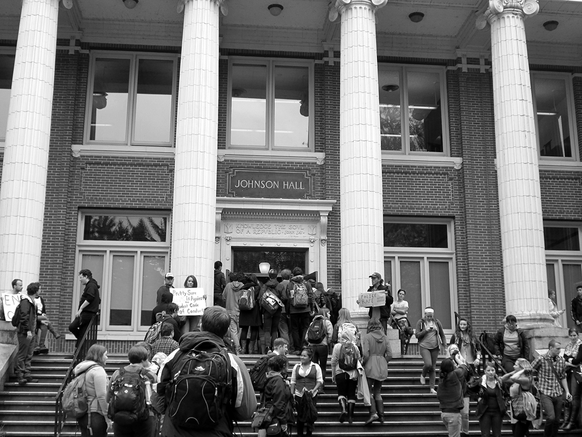 Students, faculty, and staff jammed the lobby of Johnson Hall and spilled onto the front steps to protest reporting on sexual assault allegations / May 2014.