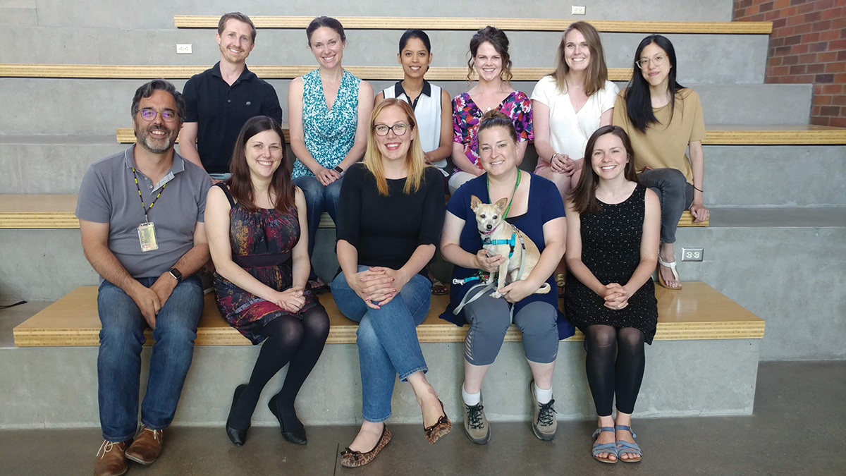 TAG (Transitions in Adolescent Girls) research team members include, top l-r: Ben Nelson, Dr. Jenn Pfeifer, Dr. Nandi Vijayakumar, Lauren Hval, Bernie Brady, Theresa Cheng, and bottom l-r: Dr. Nick Allen, Sam Chavez, Dr. Michelle Byrne, Sarah Donaldson, Izzy the dog, and Dr. Kate Mills / photo by Dr. Jim Prell.
