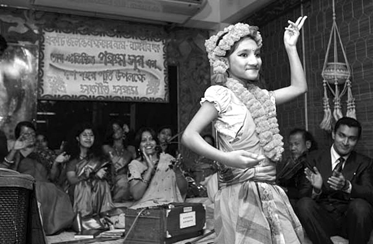 A teenager dances at the acid survivors healing group in Bangladesh.