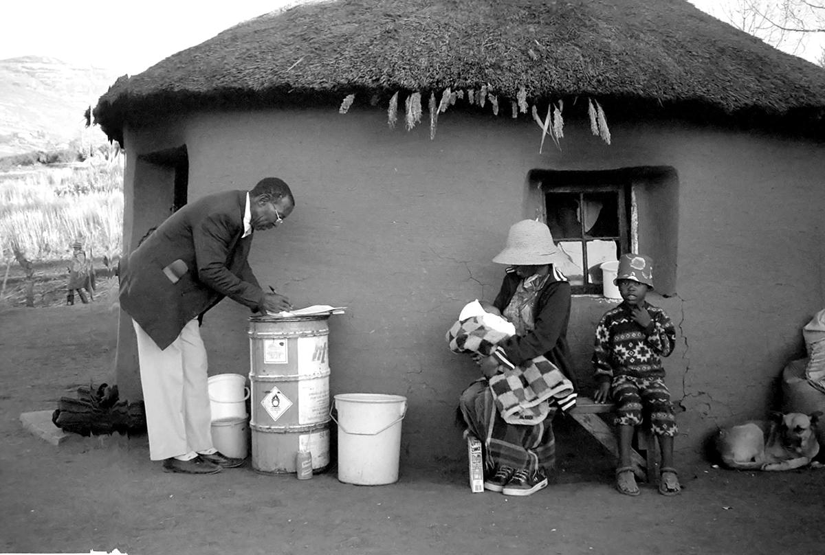 : Ntate Kholumo, member of the ’Muela research team, interviews a family affected by the Lesotho Highlands Water Project.