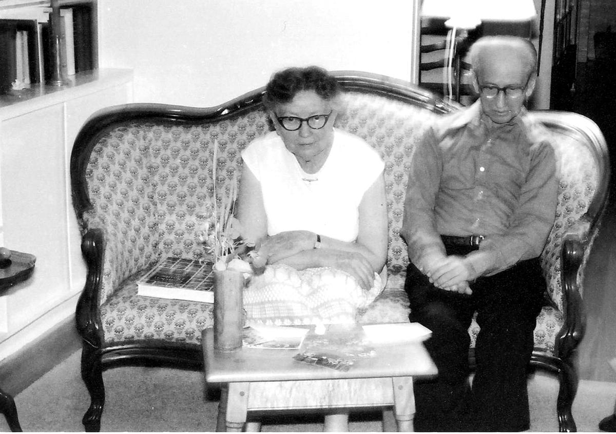 Madge and Val Lorwin watch a tea ceremony being performed in their living room, circa 1981 (photo courtesy of George Sheridan)