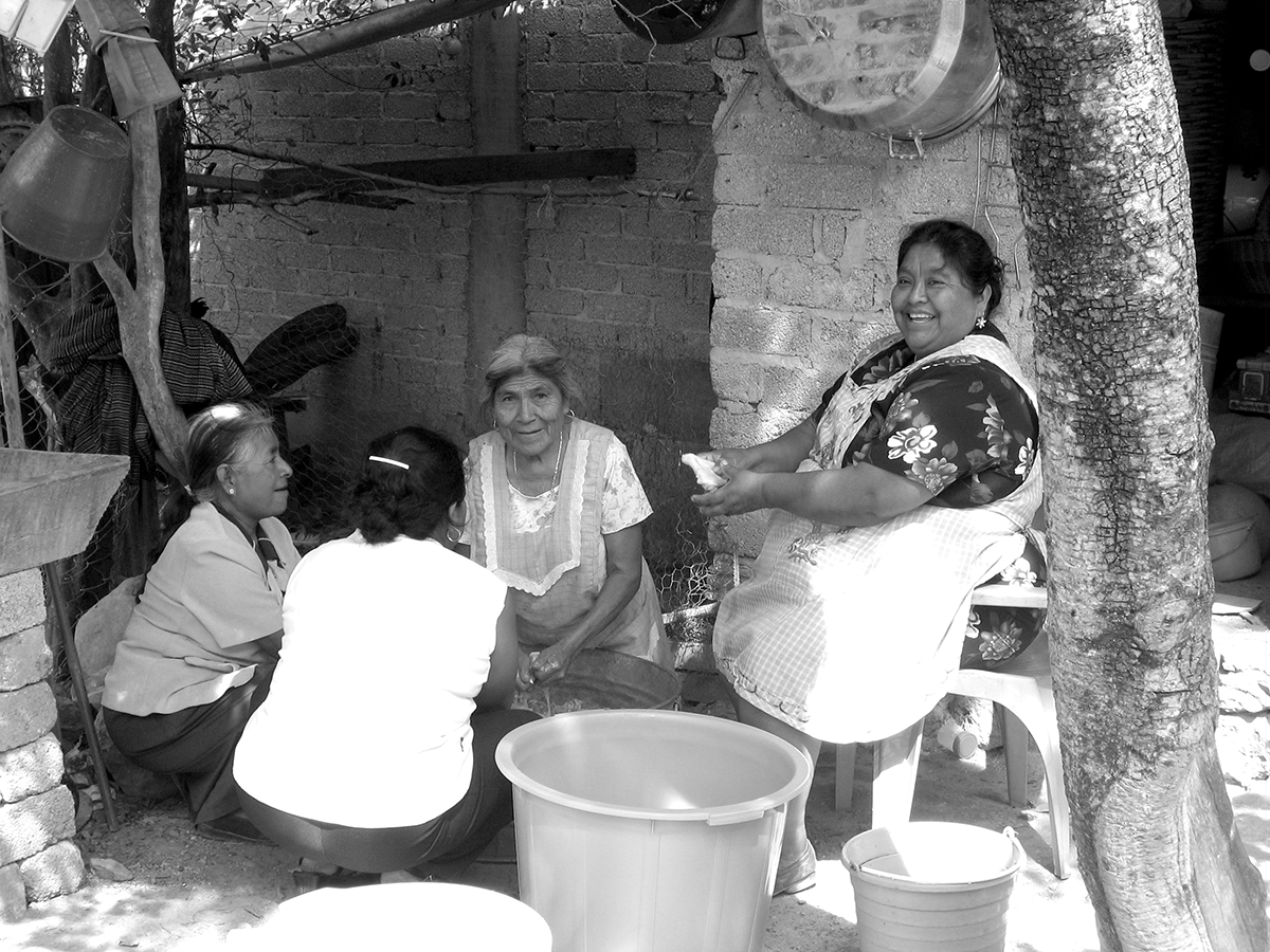 Women in San Agustin Atenango, Oaxaca working together to prepare a communal meal for a political rally