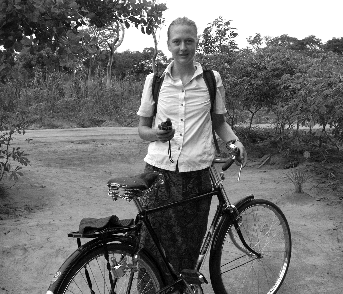 With GPS unit in hand, Ingrid L. Nelson sets out on her bicycle to survey farmer’s fields for the day. 