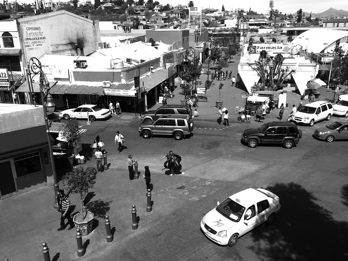 Nogales tourist area within one block of the U.S.–Mexico international boundary. The heart of “hustle” space, where deported men deploy English language skills to provide informal guide services; sell snacks, drugs, and kitschy Mexican crafts; or ask passersby for “a little help” / photos by Tobin Hansen.