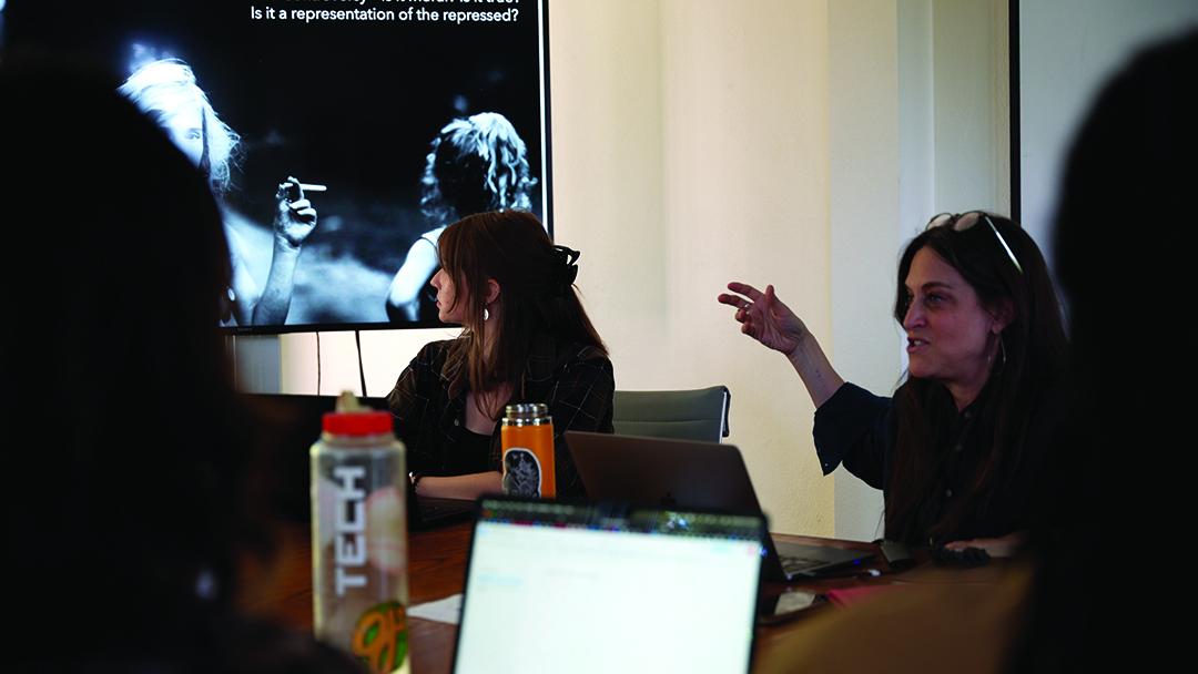 Dawn Marlan, right, discusses a photograph from Sally Man’s Family Portraits with her Calderwood Seminar students / photo by Agnese Cebere.