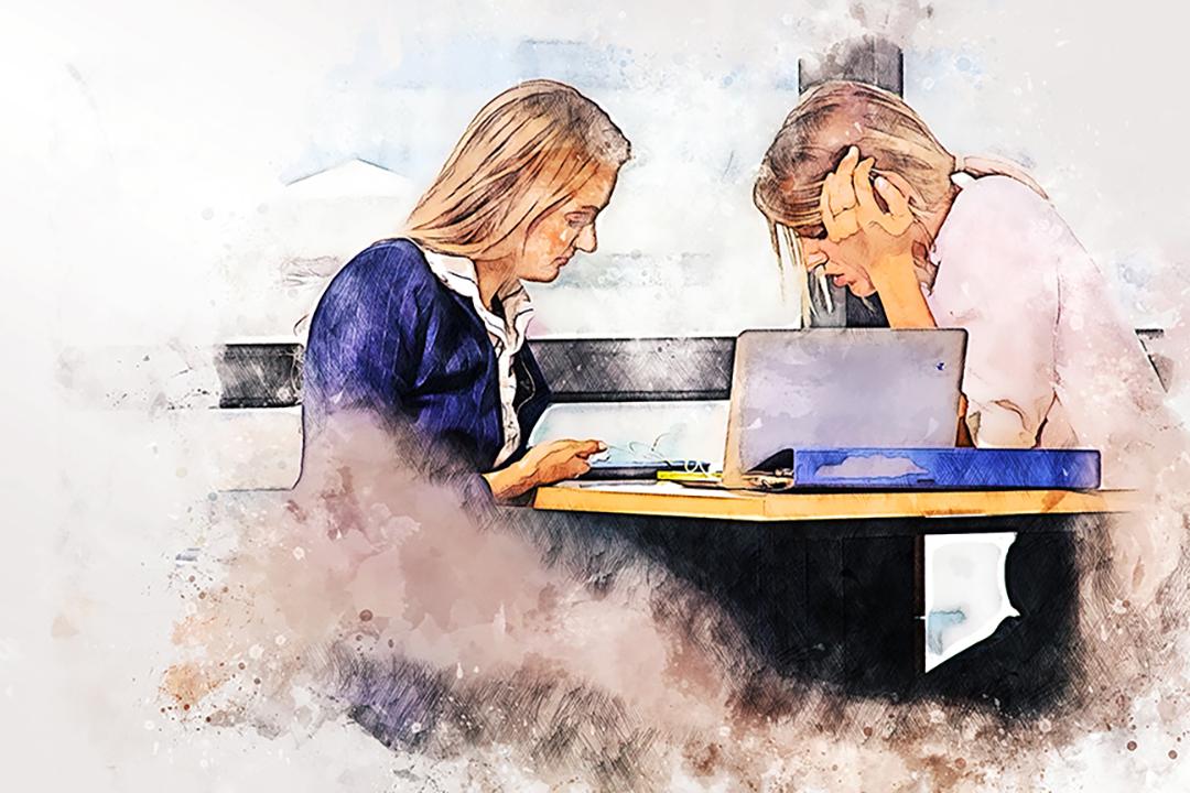 A student and mentor work together.