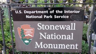 Pictured is a sign designating the Stonewall National Monument.