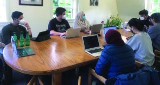 UO alumnus Baran Germen, pitured upper right, visited campus in May 2022 to discuss new media publics and social movements with Sangita Gopal’s graduate-level cinema studies class.