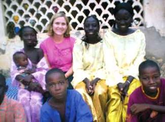 Courtney Smith (back row, center) in the small town where she conducted much of her research while supported by CSWS funding.