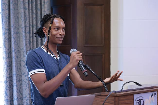 Bryant Taylor invites attendees to play a Bingo icebreaker at the 2023 New Faculty Welcome Reception / photo by Jack Liu
