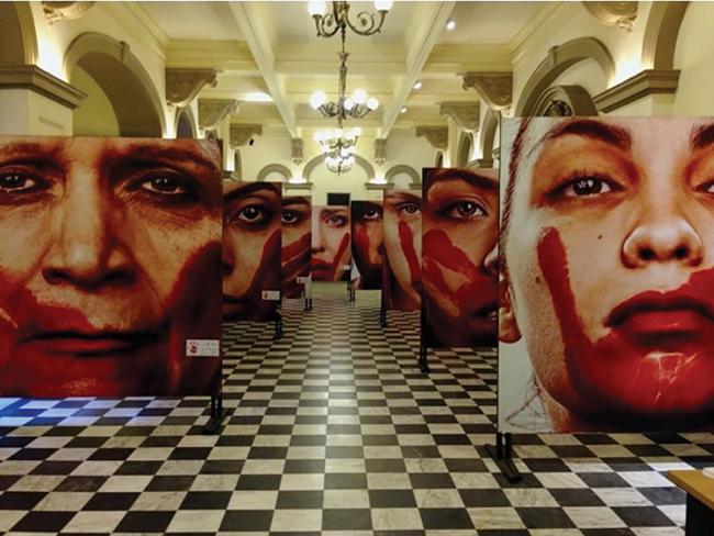 Marcio Freitas’ “Nunca Me Calarei” (I Will Never be Silenced) features the faces of women who have experienced gender-based violence in Brazil  / photo by Emily Masucci.