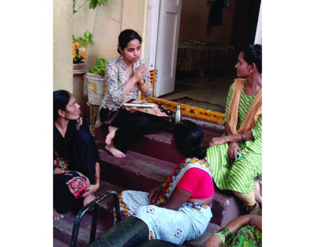 Malvya Chintakindi (center) interviews three of her participants on a recent trip to Hyderabad, India / photo provided by Chintakindi.